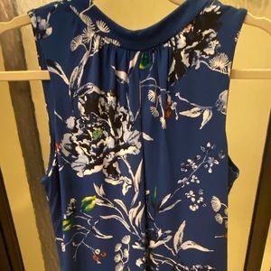 Blue and white floral top, with eye hole on chest.. very beautiful!